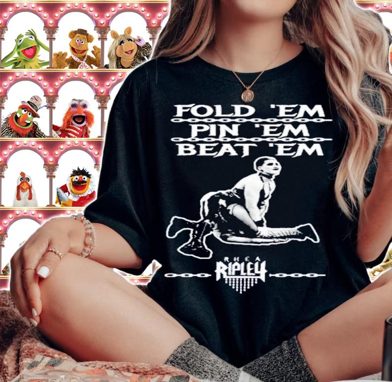 Rhea Ripley's Fold 'Em Pin 'Em Beat 'Em Shirt